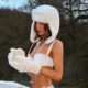 Maura Higgins shows off her sensational figure as she poses in tiny white bikini and fur hat on a winter break