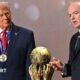 US President Donald Trump (left) and Fifa president Gianni Infantino (right) either side of the World Cup trophy at the 2026 tournament draw