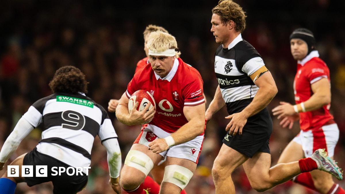 Wales' Aaron Wainwright runs with the ball against the Barbarians