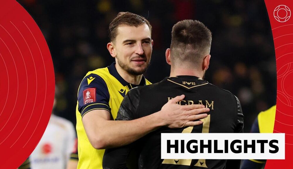Michal Helik and Matt Ingram celebrate Oxford United's FA Cup win over MK Dons