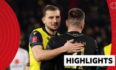 Michal Helik and Matt Ingram celebrate Oxford United's FA Cup win over MK Dons