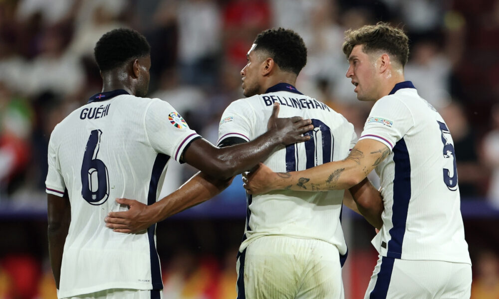 COLOGNE, GERMANY - JUNE 25: Marc Guehi, Jude Bellingham and John Stones of England during the UEFA EURO 2024 group stage match between England and Slovenia at Cologne Stadium on June 25, 2024 in Cologne, Germany. (Photo by Alex Grimm/Getty Images)