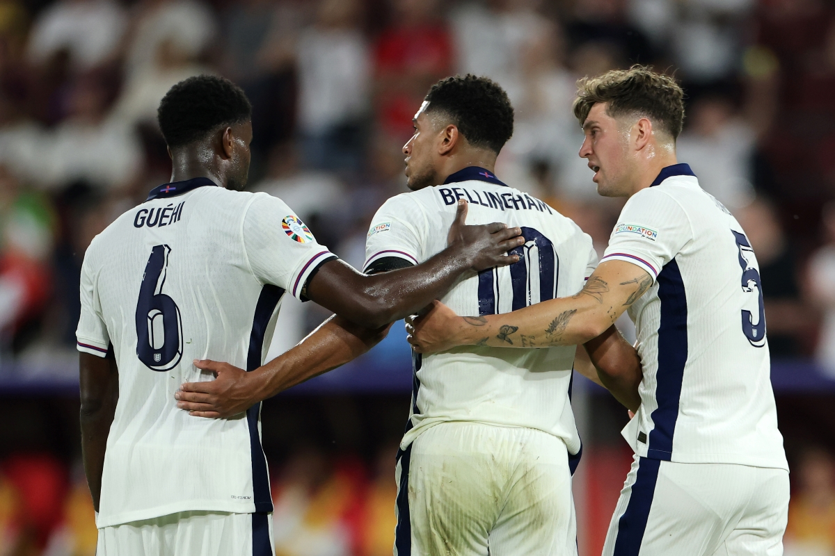 COLOGNE, GERMANY - JUNE 25: Marc Guehi, Jude Bellingham and John Stones of England during the UEFA EURO 2024 group stage match between England and Slovenia at Cologne Stadium on June 25, 2024 in Cologne, Germany. (Photo by Alex Grimm/Getty Images)