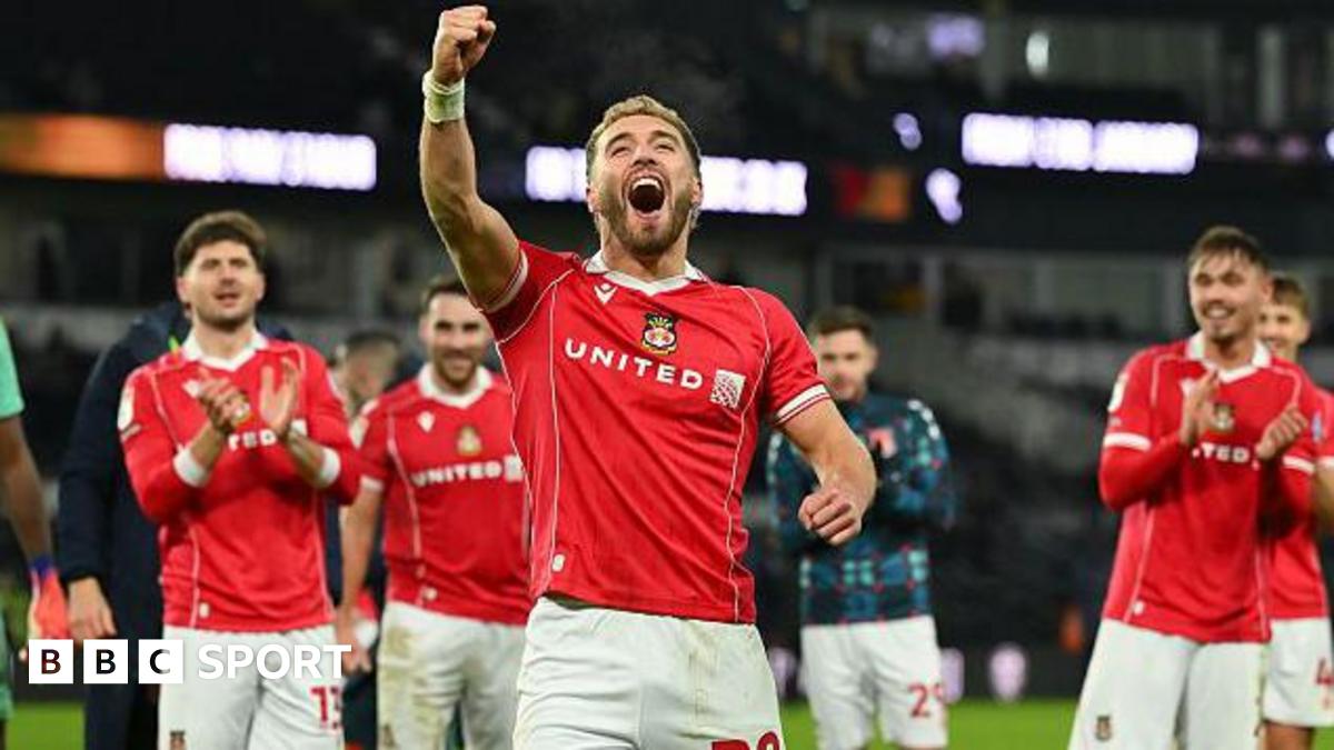 Luke Littler celebrates winning the 2026 PDC World Championship as tickertape falls