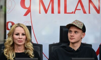 The wife of AC Milan forward Zlatan Ibrahimovic, Helena Seger (L) and their son son Maximilian Ibrahimovic looks on at the start of the Italian Serie A football match between AC Milan and Atalanta Bergamo at the San Siro stadium in Milan on May 15, 2022. (Photo by MIGUEL MEDINA / AFP) (Photo by MIGUEL MEDINA/AFP via Getty Images)