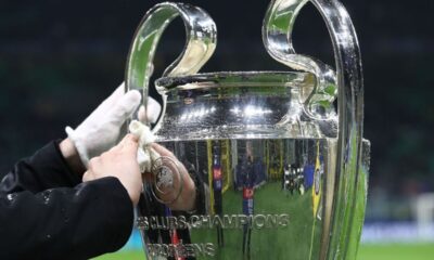 MILAN, ITALY - MARCH 11: The UEFA Champions League trophy is cleaned as it is displayed on a plinth at the side of the pitch prior to the UEFA Champions League 2024/25 UEFA Champions League 2024/25 Round of 16 Second Leg match between FC Internazionale Milano and Feyenoord at Stadio Giuseppe Meazza on March 11, 2025 in Milan, Italy. (Photo by Marco Luzzani/Getty Images)