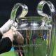 MILAN, ITALY - MARCH 11: The UEFA Champions League trophy is cleaned as it is displayed on a plinth at the side of the pitch prior to the UEFA Champions League 2024/25 UEFA Champions League 2024/25 Round of 16 Second Leg match between FC Internazionale Milano and Feyenoord at Stadio Giuseppe Meazza on March 11, 2025 in Milan, Italy. (Photo by Marco Luzzani/Getty Images)