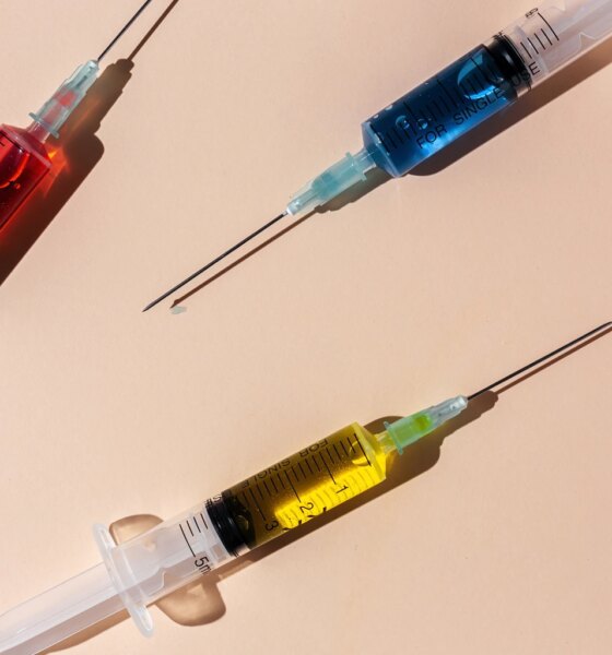 Covid-19- Vaccine vial dose against coronavirus needle syringe, medical concept vaccination