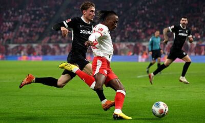 Yan Diomande of RB Leipzig crosses the ball during the Bundesliga match between RB Leipzig and SC Freiburg at Red Bull Arena