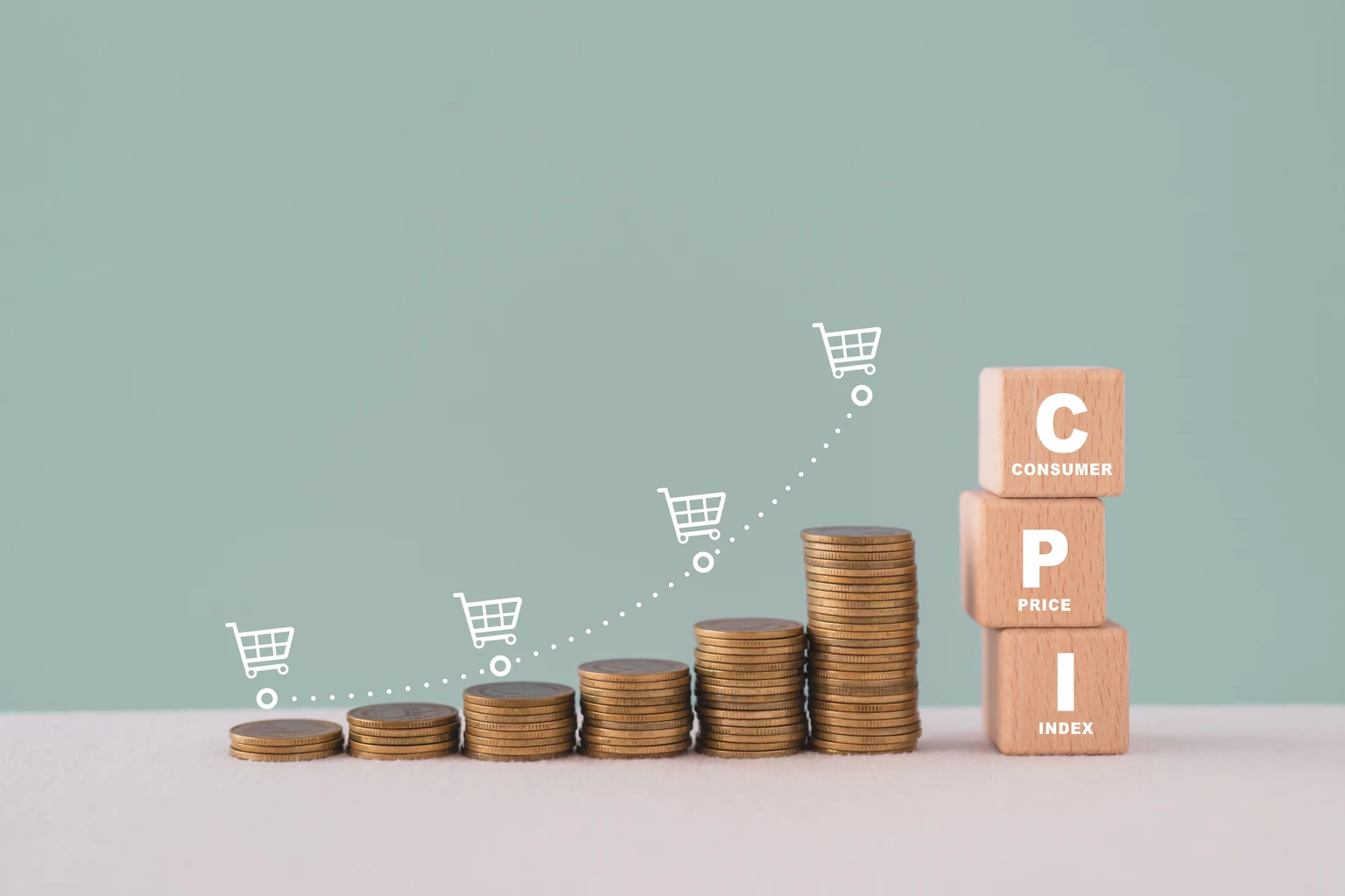 CPI, consumer price index concept. Wooden block with CPI word and stack of coins and increasing graph with shopping cart icon. Goods price inflation and inflation rising. Impact on economic growth