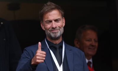 Jurgen Klopp gives a thumb up in the stands at Anfield