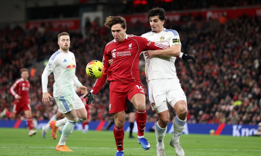 LIVERPOOL, ENGLAND - JANUARY 01: Federico Chiesa of Liverpool is challenged by Pascal Struijk of Leeds United during the Premier League match between Liverpool and Leeds United at Anfield on January 01, 2026 in Liverpool, England. (Photo by Jan Kruger/Getty Images)