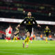 Matheus Cunha of Manchester United celebrates scoring a goal to make the score 2-3 during the Premier League match between Arsenal and Manchester...