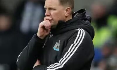 Newcastle United manager Eddie Howe puts his hand to his face.