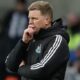 Newcastle United manager Eddie Howe puts his hand to his face.