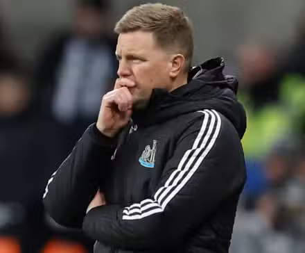 Newcastle United manager Eddie Howe puts his hand to his face.