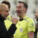 Manchester City manager Pep Guardiola talks with referee Chris Kavanagh and assistant referees