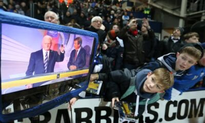 Young fans watching the FA Cup draw on TV.