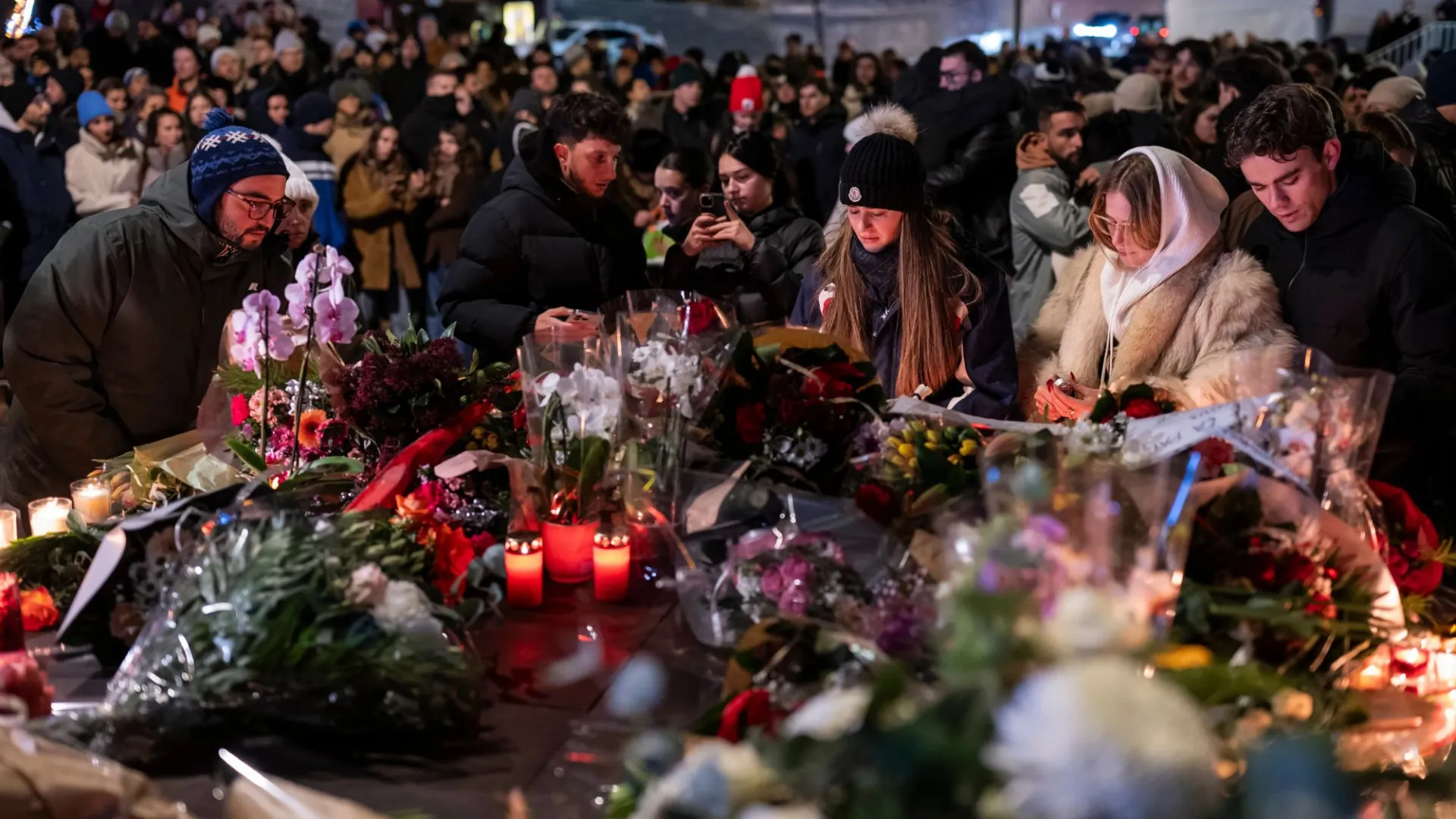 Parents are desperately searching for children after Swiss ski resort inferno as hundreds gather for heartbreaking vigil
