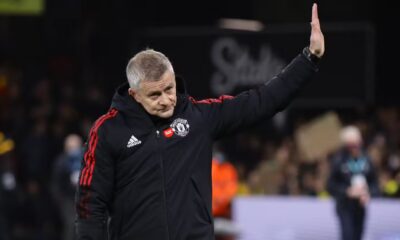 Manchester United manager Ole Gunnar Solskjaer waves to the travelling United supporters at Vicarage Road.