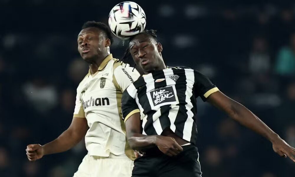 RC Lens' Samson Baidoo in action with Angers SCO's Sidiki Cherif