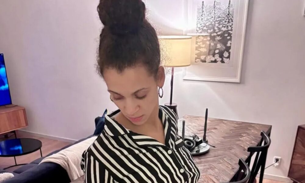 The Traitors star confirms she's pregnant as she shows off growing baby bump in new photo