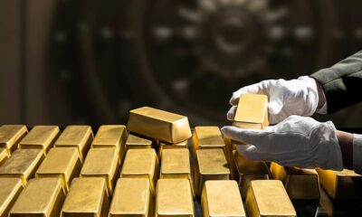 Gold breaks $5,000 an ounce for first time as investors flee to safety