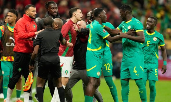 Senegal's and Morocco[s players scuffle after a penalty call during the Africa Cup of Nations final soccer match between Senegal and Morocco, in Rabat, Morocco, Sunday, Jan. 18, 2026. (AP Photo/Mosa'ab Elshamy)