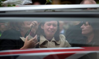 Mourners grieve as Private Gareth Bellingham and Craftsman Andrew Found are repatriated through Wootton Bassett. Pic: Reuters