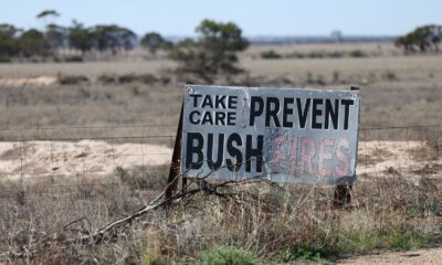 A sign promoting bushfire awareness lines the road near Wongan Hills, Australia. Pic: Reuters