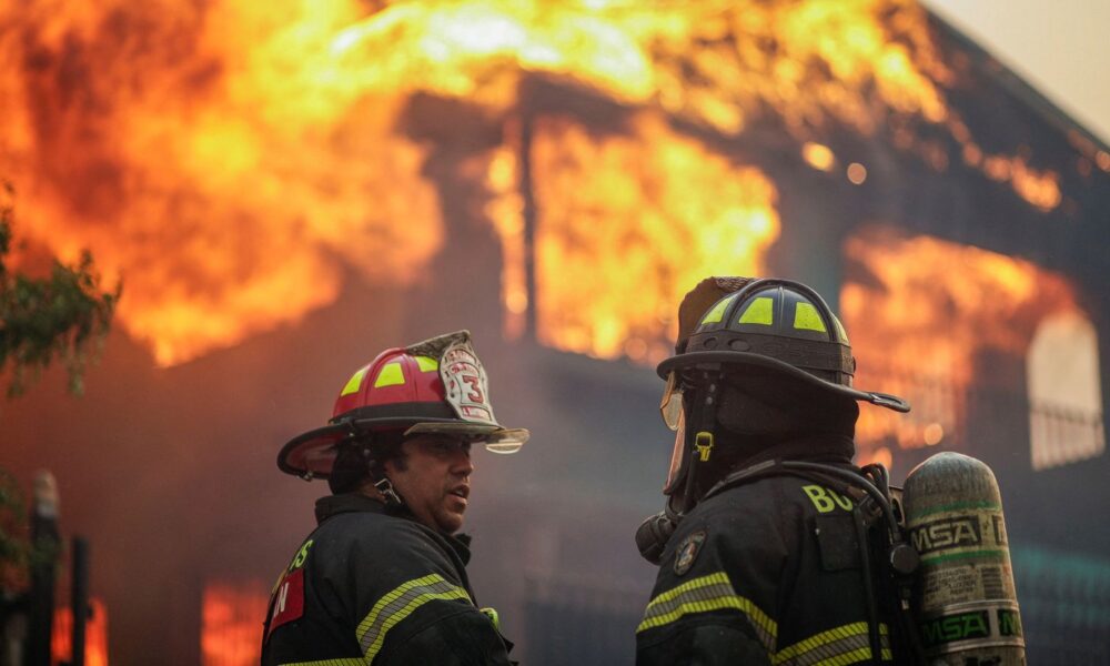 Firefighters during the wildfire that prompted emergency evacuations in Chile. Pic: Reuters