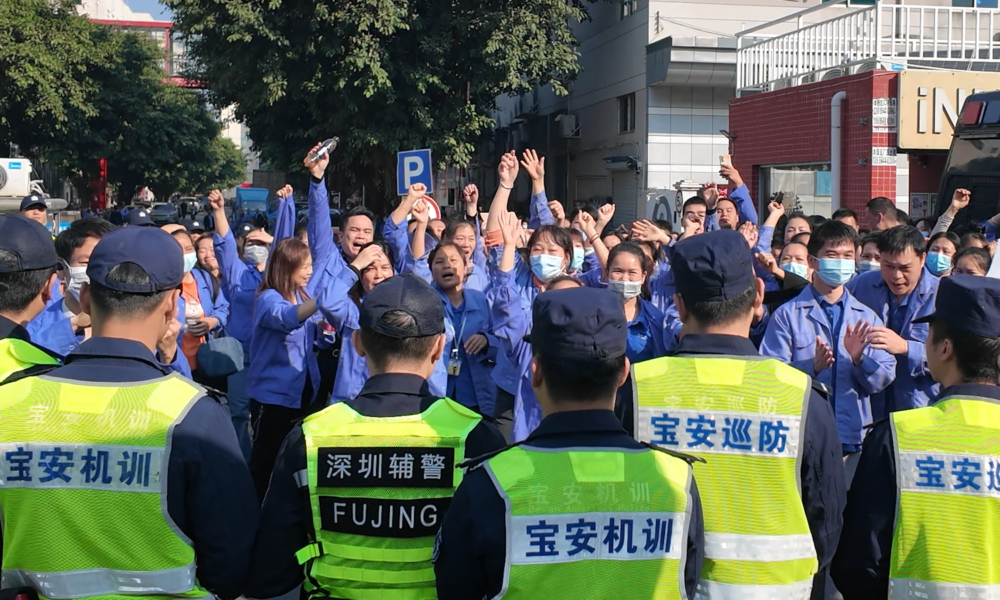 Workers at a consumer electronics factory in Shenzhen protest after a reduction in overtime availability