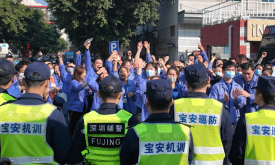 Workers at a consumer electronics factory in Shenzhen protest after a reduction in overtime availability