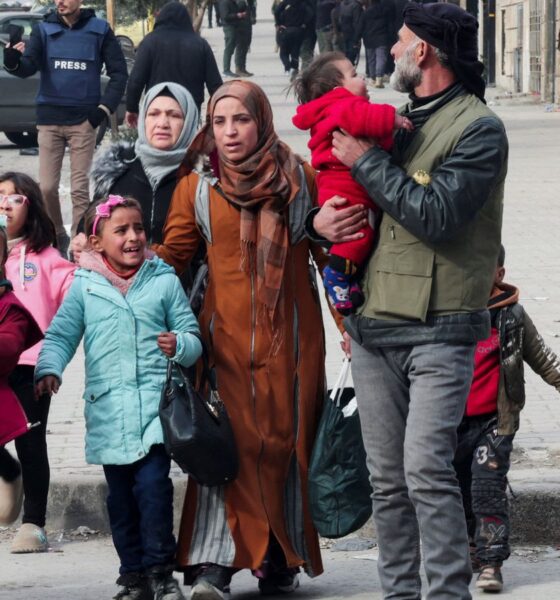 People have been evacuating with whatever they can carry. Pic: Reuters