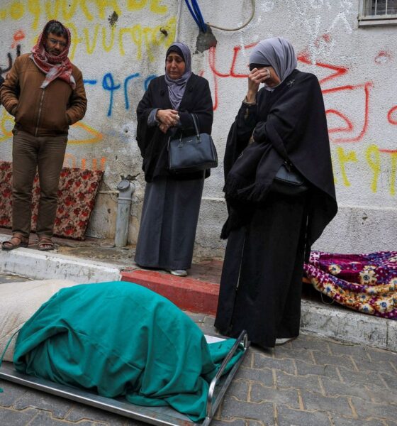 Mourners gather next to bodies at funeral of Palestinians who, according to medics, were killed after a wall collapsed. Pic: Reuters