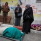 Mourners gather next to bodies at funeral of Palestinians who, according to medics, were killed after a wall collapsed. Pic: Reuters