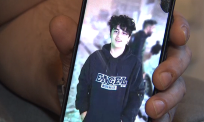 Amir Ali Haydari's cousin shows us a photo of his cousin.