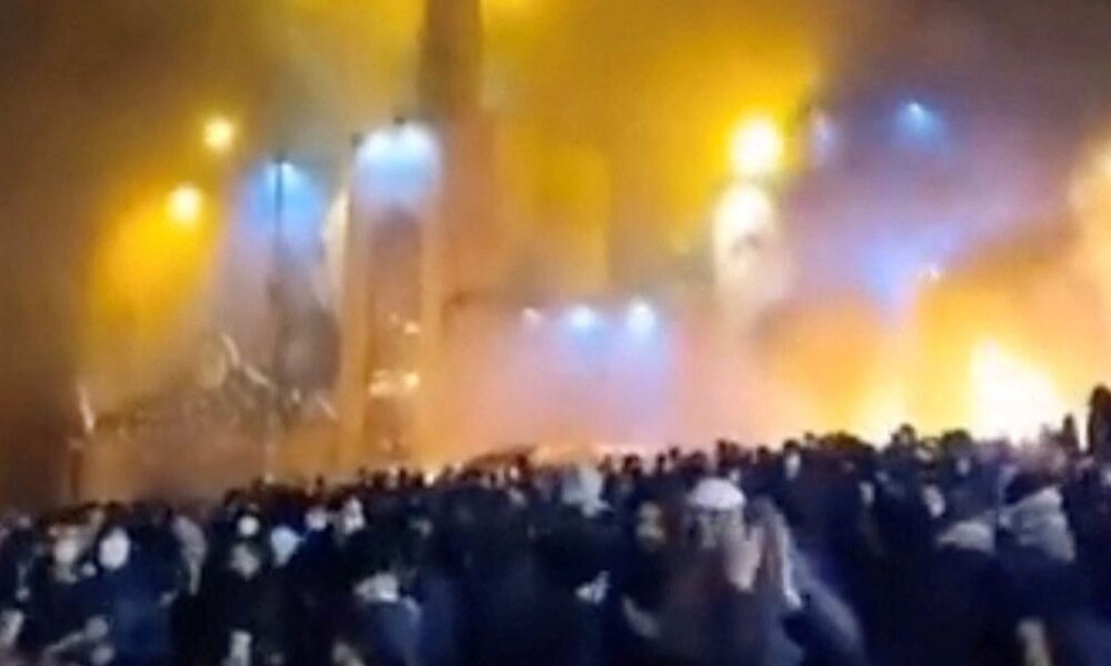 Smoke rises from a mosque as protesters gather amid evolving anti-government unrest in Tehran, Iran. Pic: Social Media / Reuters
