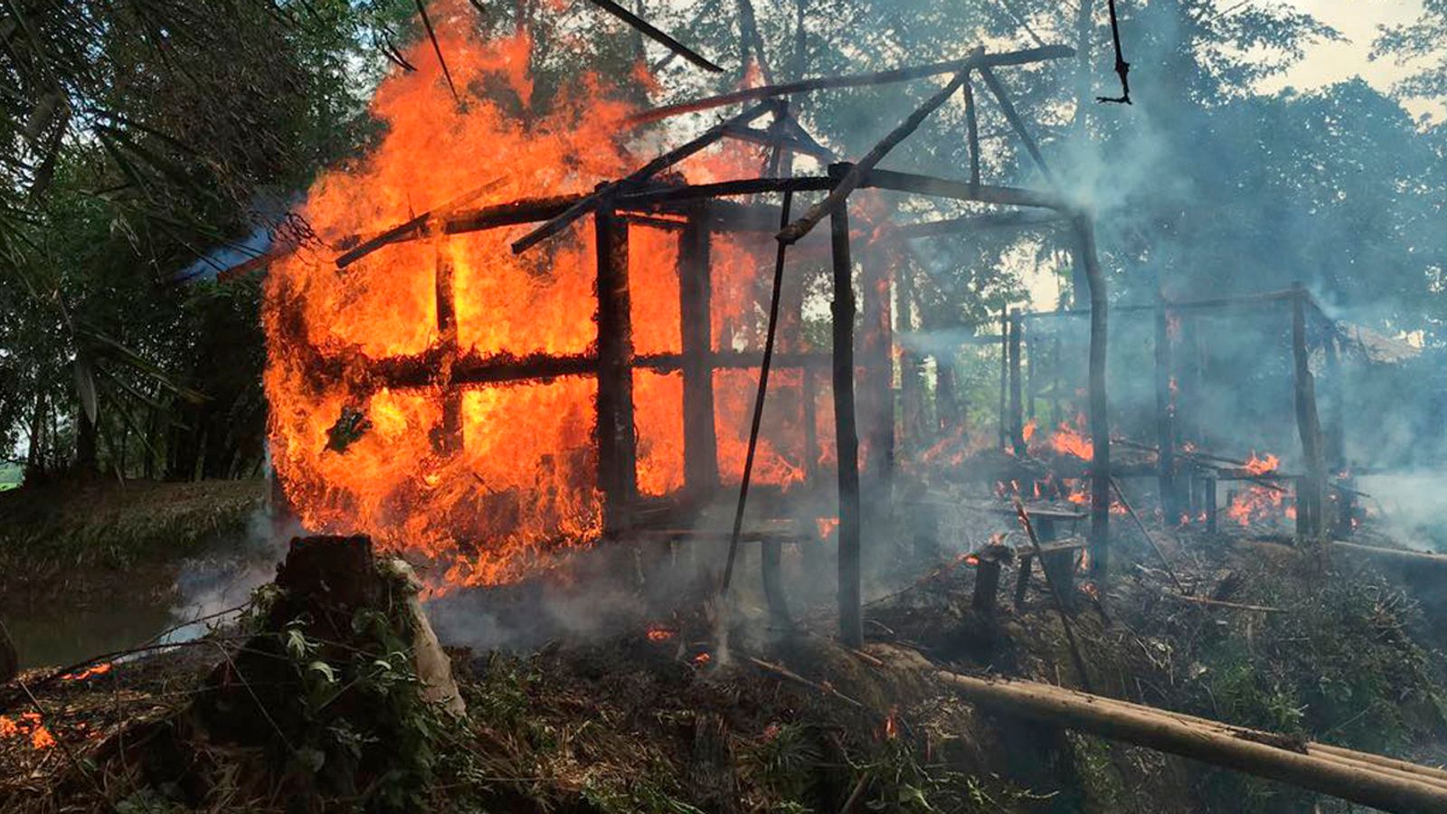 A house on fire in northern Rakhine state, Myanmar, in 2017. File pic: AP