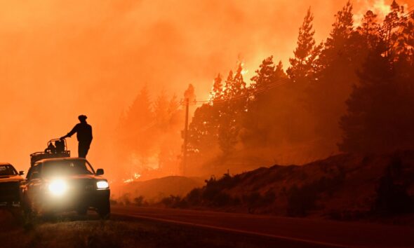 Firefighters in El Hoyo, Patagonia, Argentina. Pic: AP