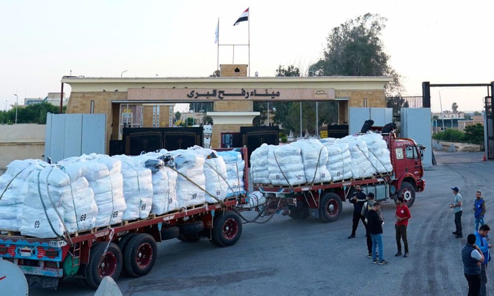 A truck carries aid through the Egyptian gate of the crossing in October. Pic: AP