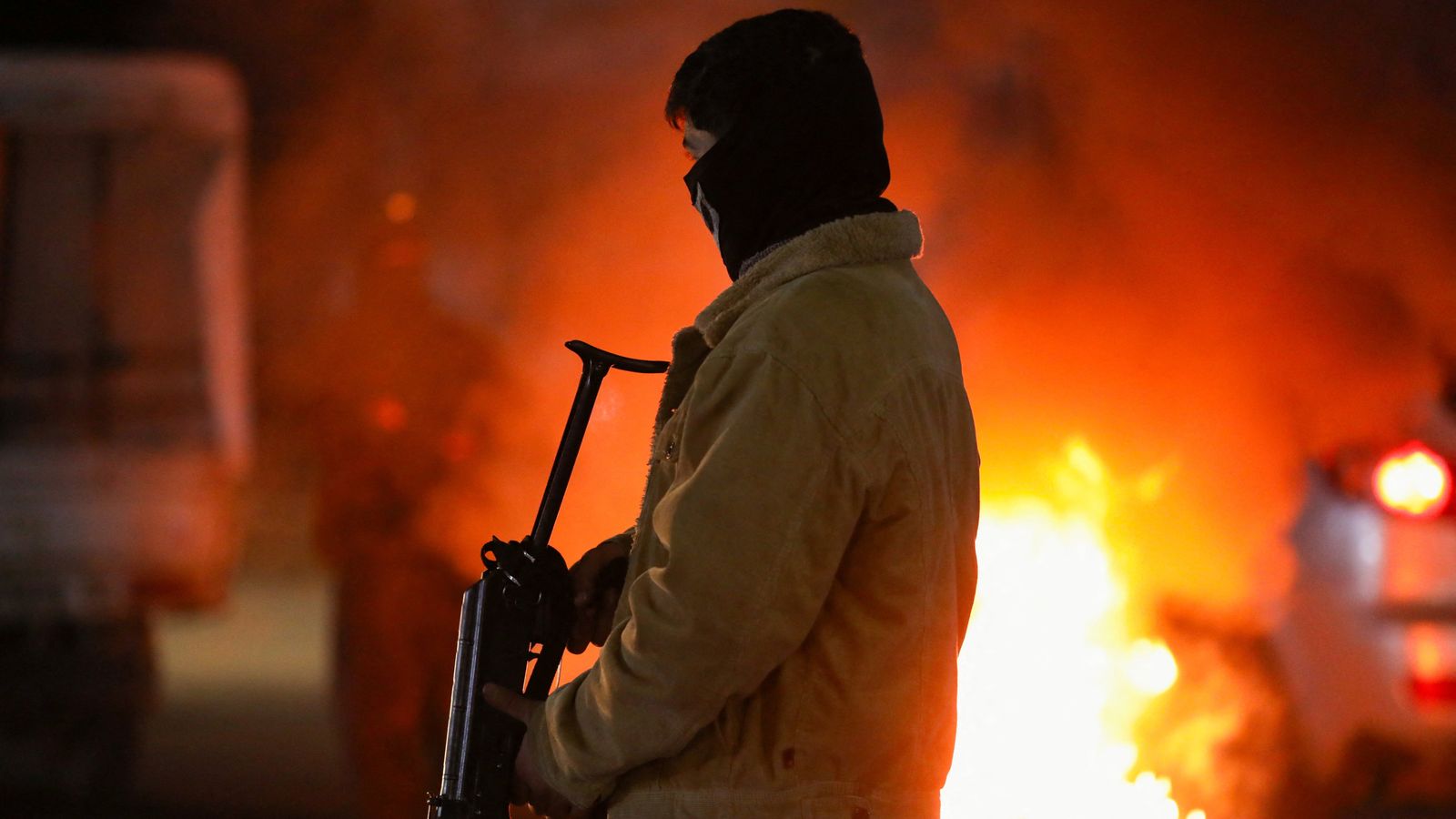 A Kurdish volunteer at a checkpoint in Qamishli, Syria. Pic: Reuters
