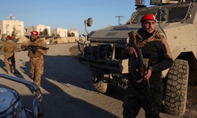 Syrian government forces outside Al-Aqtan prison near Raqqa. Pic: AP