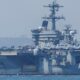 The USS Abraham Lincoln (pictured) and several guided-missile destroyers are due to arrive in the region in the coming days. Pic: Reuters