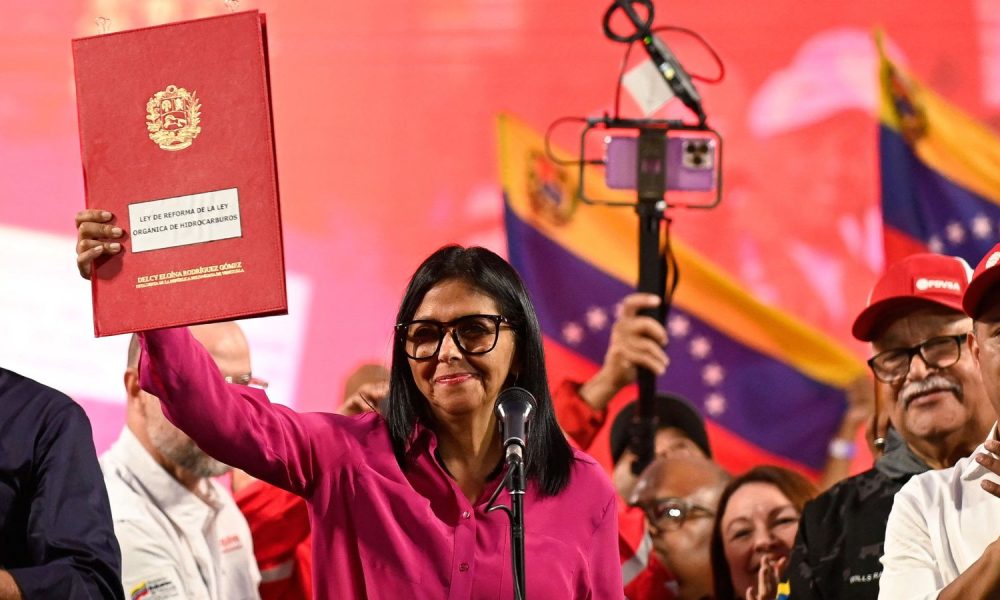 Venezuela's interim president Delcy Rodriguez signed the reform into law. Pic: Reuters
