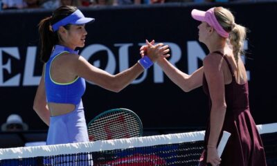 Anastasia Potapova of Austria is congratulated by Emma Raducanu, left, of Britain following their second round match at the Australian Open