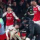 Conor Bradley of Liverpool is treated for injury as Gabriel Martinelli and Gabriel Magalhaes of Arsenal look on