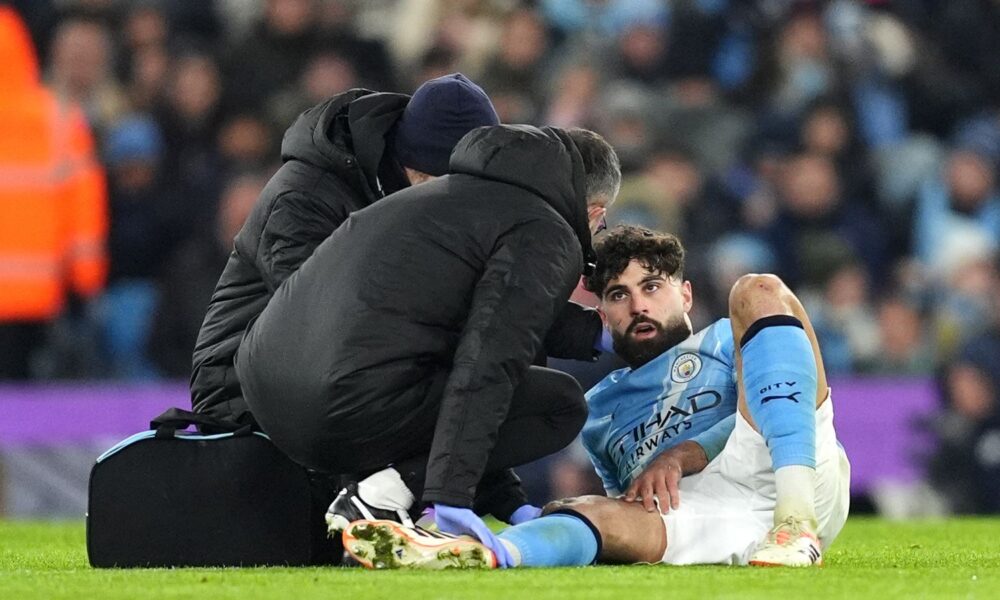 Manchester City's Josko Gvardiol receives treatment for an injury