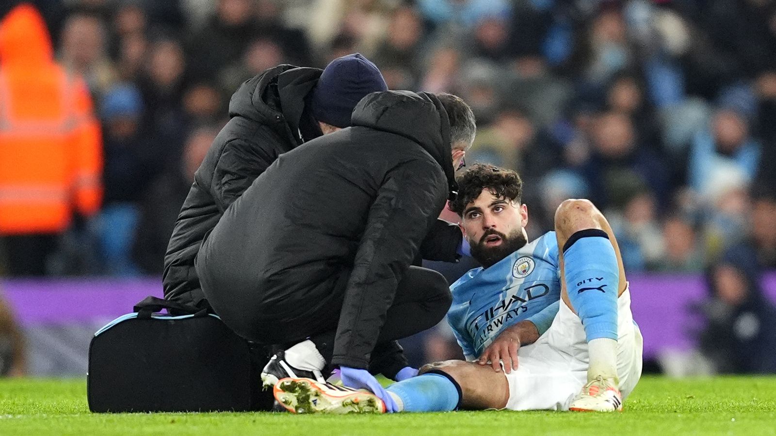 Manchester City's Josko Gvardiol receives treatment for an injury