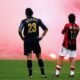 Marco Materazzi of Inter Milan and Rui Costa of AC Milan look on during the Champions League quarter-final second leg at San Siro in 2005